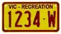 Recreational vehicle number plate from VicRoads, showing the distinct yellow plate and maroon characters featuring the number 1234 and the letter W. For RVs registered in Victoria.